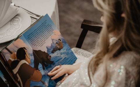Child reading a book