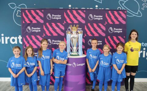 Girls team receive Premier League football kit